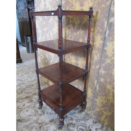 1385 - A early 19th century mahogany four tier watnot of square cut form enclosing a shallow lower frieze d... 