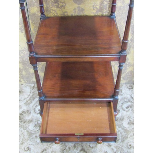 1385 - A early 19th century mahogany four tier watnot of square cut form enclosing a shallow lower frieze d... 