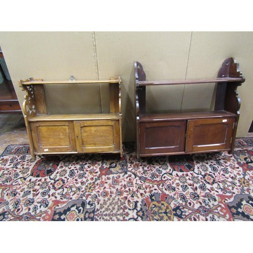 1451 - A 19th century oak wall mounted bookshelf partially enclosed and a further mahogany example