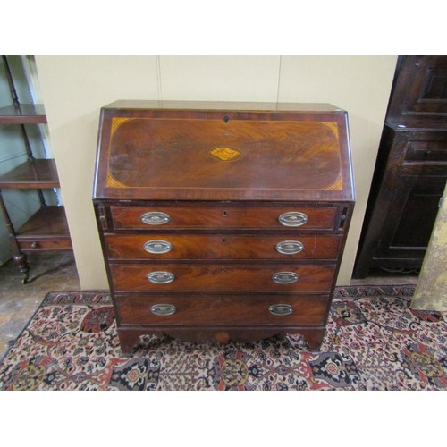 1380 - A Georgian mahogany bureau with inlaid detail of four long graduated drawers, the fall flap enclosin... 