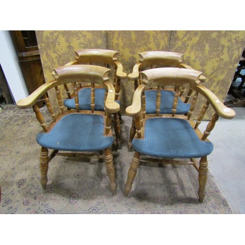 1299 - A set of four beechwood contemporary smokers bow elbow chairs