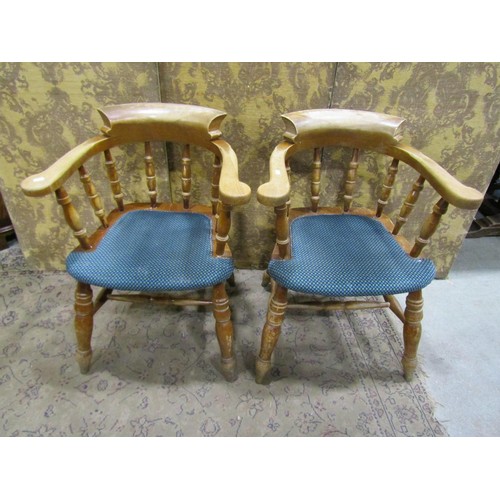 1299 - A set of four beechwood contemporary smokers bow elbow chairs