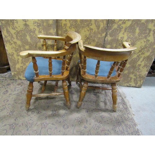 1299 - A set of four beechwood contemporary smokers bow elbow chairs