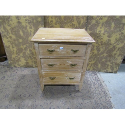 1186 - A small Edwardian stripped pine three drawer chest on square tapered supports, 77cm high x 61cm x 44... 