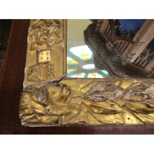 1440 - An 18th century carved pine and gilded wall mirror of arched outline showing cherubs, floral bands, ... 