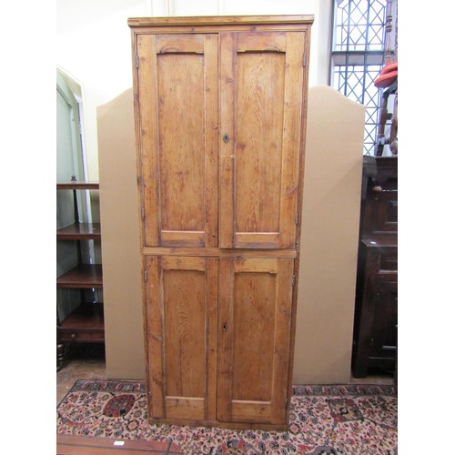 1345 - A 19th century waxed pine food cupboard on two tiers enclosed by two pairs of panelled doors with sh... 