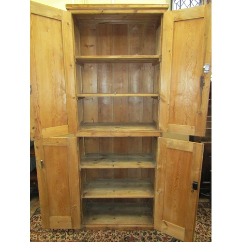 1345 - A 19th century waxed pine food cupboard on two tiers enclosed by two pairs of panelled doors with sh... 