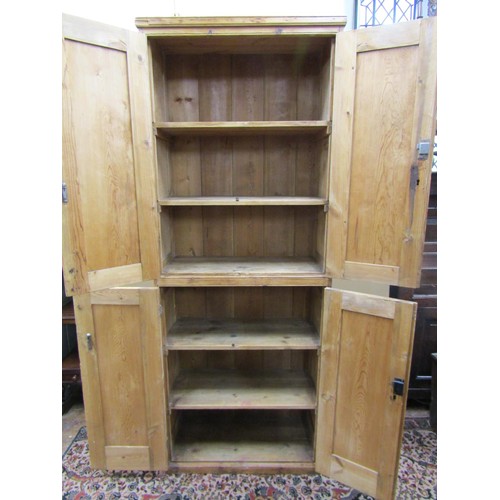 1345 - A 19th century waxed pine food cupboard on two tiers enclosed by two pairs of panelled doors with sh... 