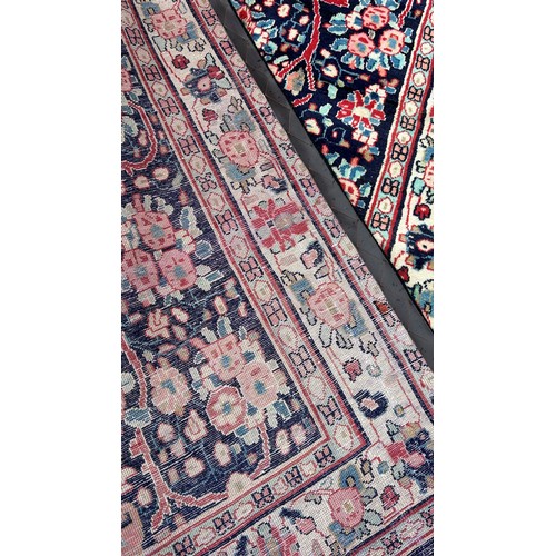 1607 - North West Persian Sarouk rug, with an all over floral pattern on a blue ground 250cm x 130cm approx... 