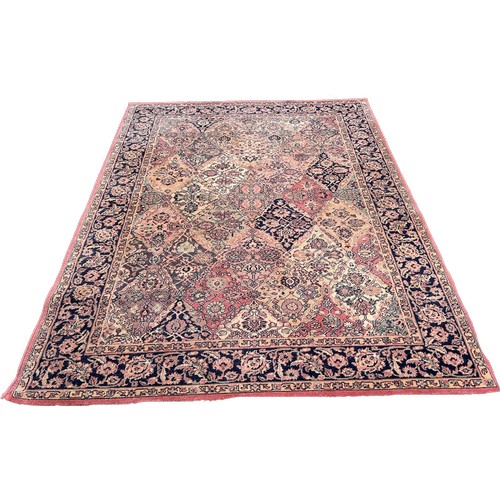 1609 - A Wilton type machine made Middle Eastern designed carpet with an all over floral pattern, 237cm x 1... 