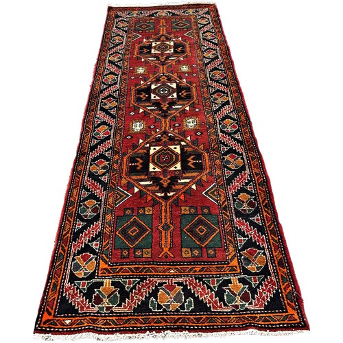 1619 - South West Persian Qashgai runner, with three interlocking stepped medallions 320cm x 103cm approxim... 