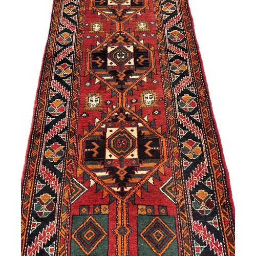 1619 - South West Persian Qashgai runner, with three interlocking stepped medallions 320cm x 103cm approxim... 