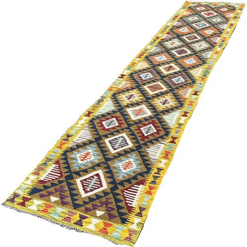 1620 - A Maimana Kilim Runner, with an all over multicoloured diamond pattern, 408cm x 83cm approximately