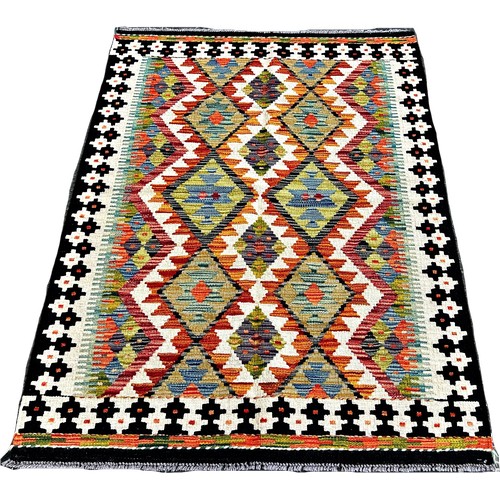 1621 - A Chobi Kilim rug with four alternating rows of stepped diamonds 148cm x 105cm approximately