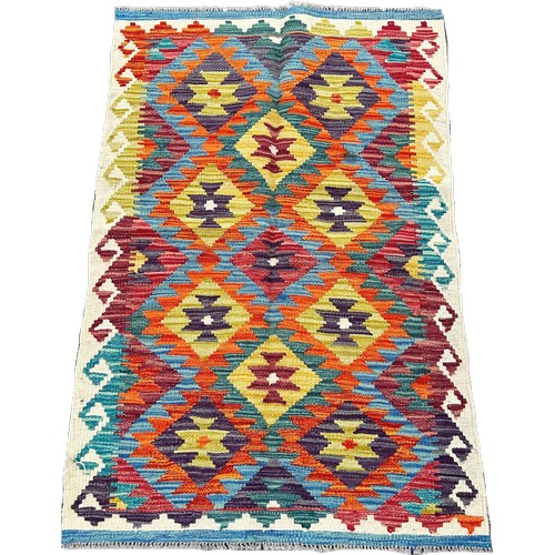 1627 - A Chobi Kilim rug with an all over multicoloured diamond pattern 125cm x 80cm approximately