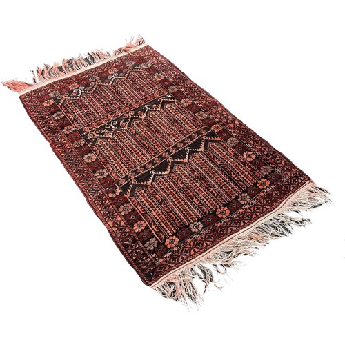 1629 - A small Afghan prayer mat with geometric panels and floral surround, 140cm x 90cm approximately