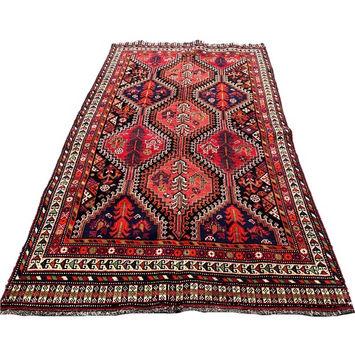 1630 - South West Persian Qashgai rug, with an all over interlocking lozenge pattern 280cm x 148cm approxim... 