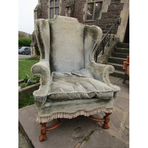 1478 - An antique wing chair in the William & Mary design with green upholstery