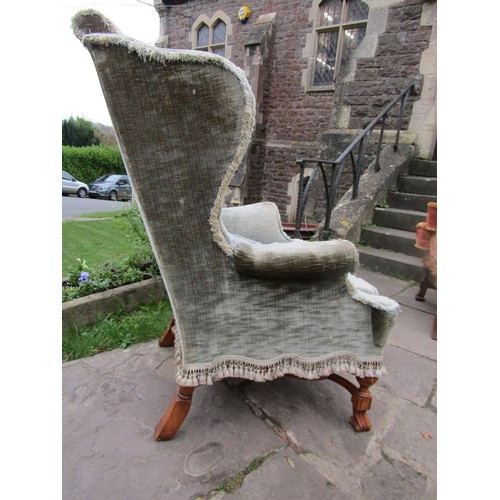 1478 - An antique wing chair in the William & Mary design with green upholstery