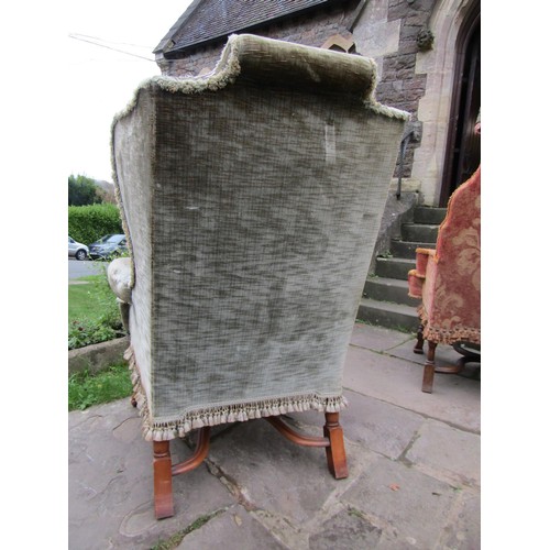 1478 - An antique wing chair in the William & Mary design with green upholstery