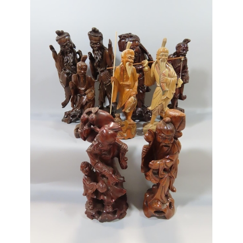 362 - Nine Chinese hardwood carvings of Sages, Craftsmen, Farmers, Fishermen etc