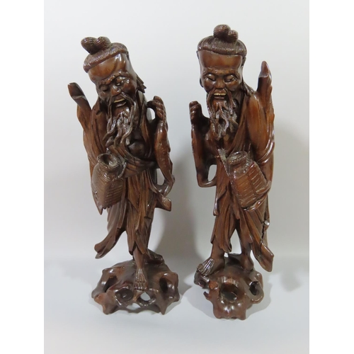 362 - Nine Chinese hardwood carvings of Sages, Craftsmen, Farmers, Fishermen etc