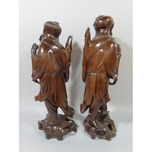 362 - Nine Chinese hardwood carvings of Sages, Craftsmen, Farmers, Fishermen etc