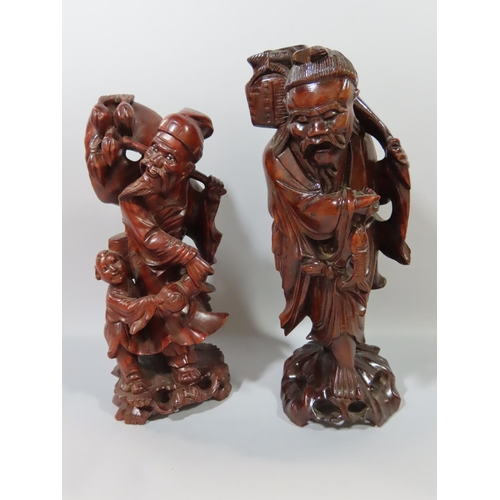 362 - Nine Chinese hardwood carvings of Sages, Craftsmen, Farmers, Fishermen etc