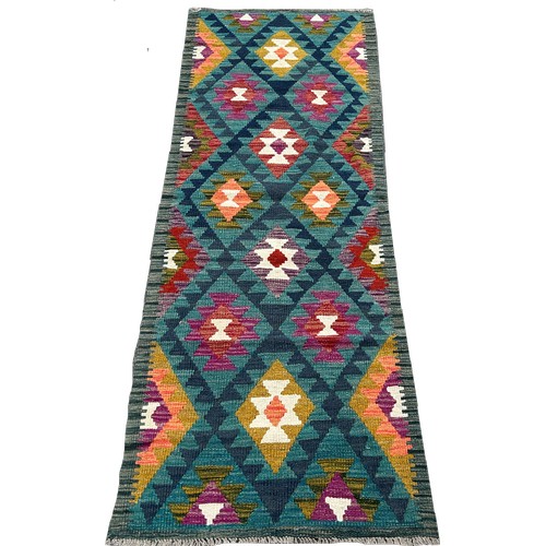 1636 - A Maimana Kilim runner, with rows of stepped medallions, 192cm x 70cm approximately