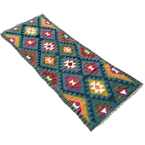 1636 - A Maimana Kilim runner, with rows of stepped medallions, 192cm x 70cm approximately