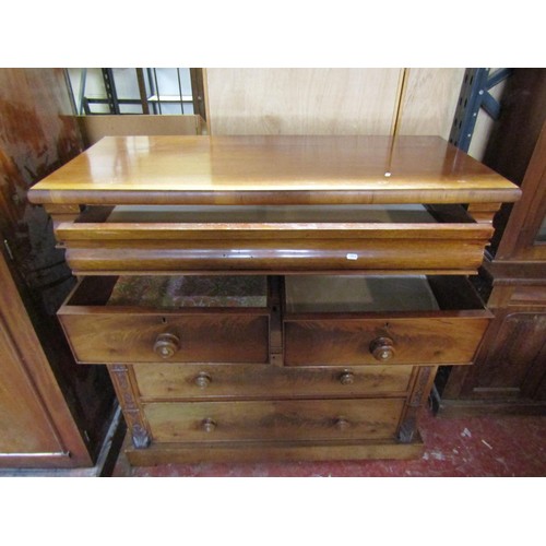 1515 - A mahogany chest of two short and three long drawers and further cushion moulded drawer, within carv... 