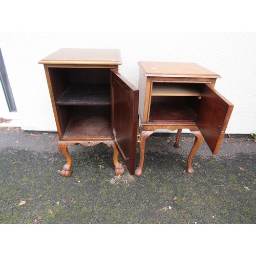 1520 - A figured walnut bedside cupboard on cabriole supports, further example on lions paw feet