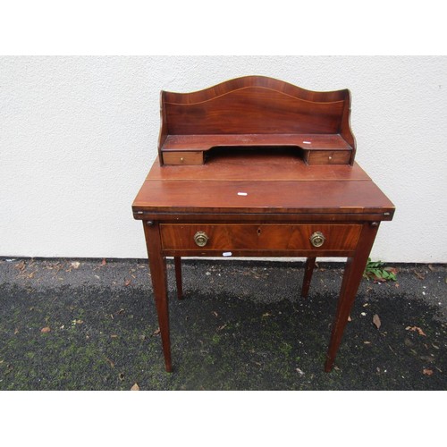 1521 - A small mahogany writing desk with folding top and raised back over a frieze drawer with square tape... 