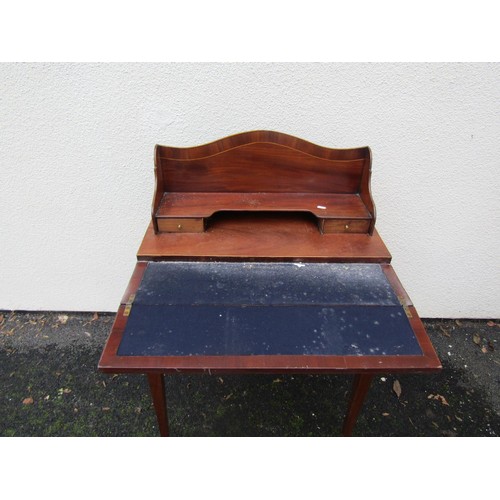 1521 - A small mahogany writing desk with folding top and raised back over a frieze drawer with square tape... 