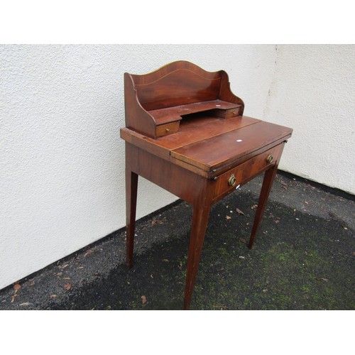 1521 - A small mahogany writing desk with folding top and raised back over a frieze drawer with square tape... 