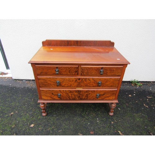 1522 - A walnut chest of two long and two short drawers on turned supports, 90cm wide