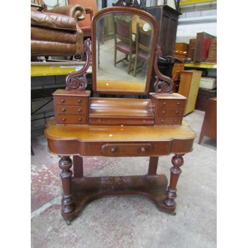 1523 - A Duchess style mahogany dressing table on turned supports