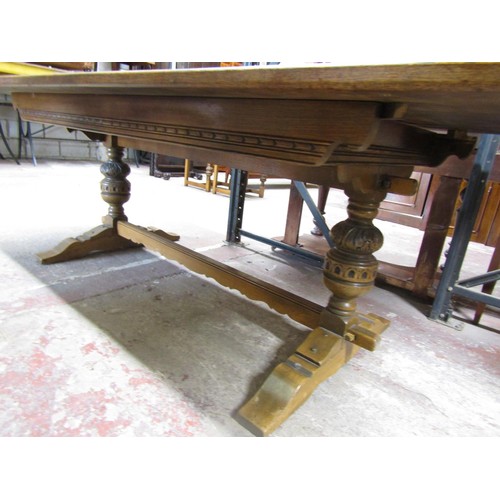 1527 - Large old English oak style refectory table raised on carved pillars with central stretcher, togethe... 