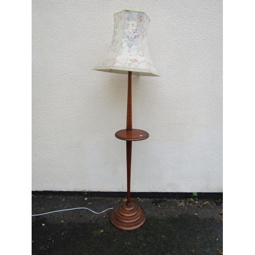 1528 - An early mid 20th century floor standing oak standard lamp on stepped circular base