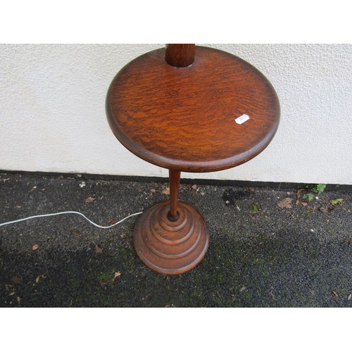 1528 - An early mid 20th century floor standing oak standard lamp on stepped circular base