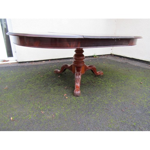 1529 - Victorian mahogany D end extending dining table to seat six, raised on a turned pillar and carved tr... 