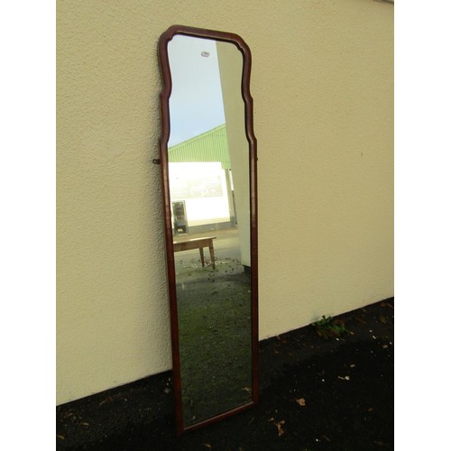 1538 - A mahogany framed wall mounted dressing mirror, 136cm tall x 35cm wide