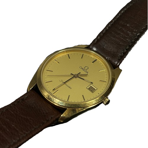 311 - Omega: A gentleman's vintage gold plated Omega Seamaster automatic wrist watch, on Omega leather str... 