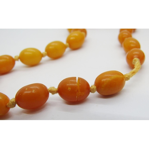 273 - Graduated amber coloured bead necklace, largest bead 2 x 1.5cm approx, 41g (one bead af)