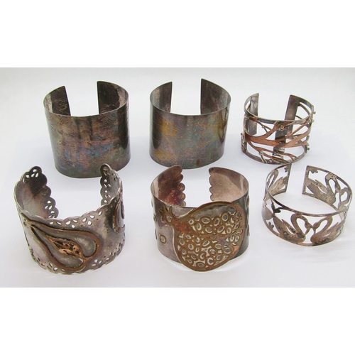 275 - Six decorative handcrafted silver / white metal cuff bracelets, some also with copper detail, three ... 