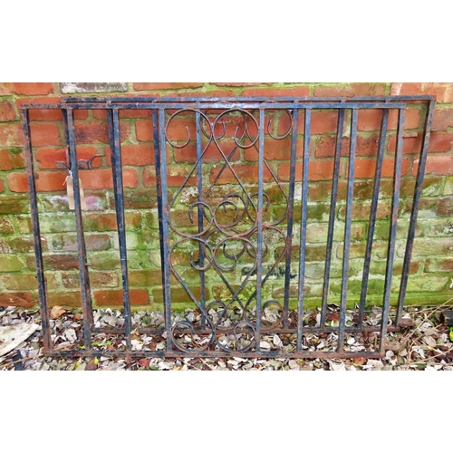 1027 - A pair of heavy gauge ironwork driveway entrance gates, with vertical open square rails flanking cen... 