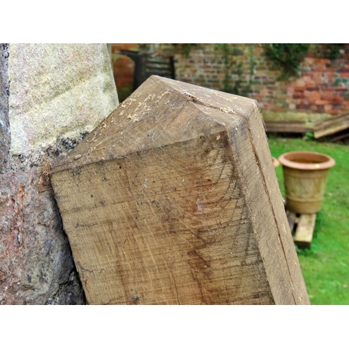 1031 - A square oak post with squat facetted pyramid cap, 15cm square x 7ft high