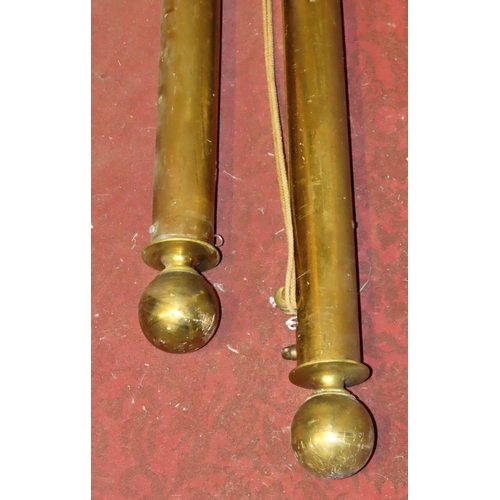 1076 - A pair of Victorian brass curtain rails/poles with sphere finials, sliding track and weight draw cor... 