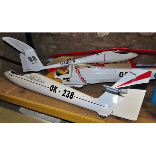 1092 - A Collection of remote control model gliders together with a quantity of parts and accessories, aero... 