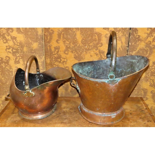 1097 - Two 19th century copper helmet shaped coal scuttles together with a brass cylindrical coal bin in th... 